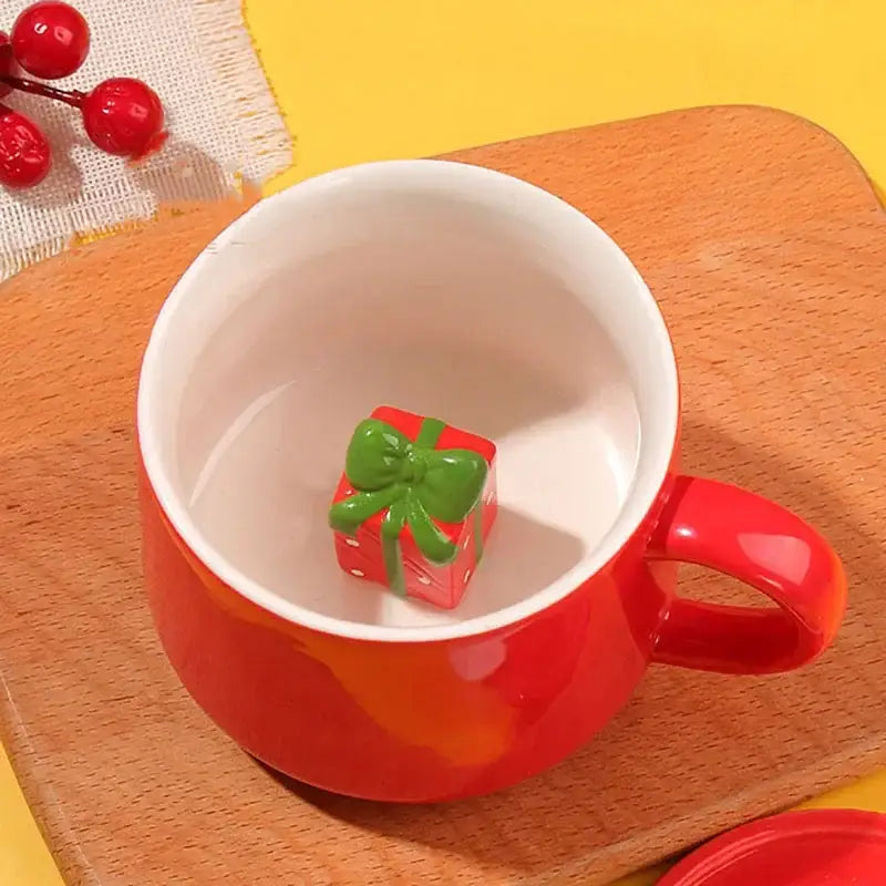 Red porcelain christmas animals ceramic mug with glossy finish featuring a red gift box ornament with green bow inside
