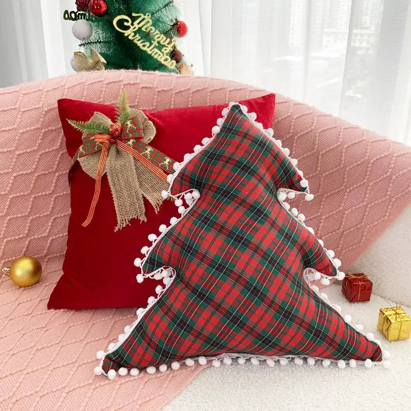 Red and green plaid christmas tree-shaped pillow with white pom-pom trim from decorbites christmas bow patchwork velvet set
