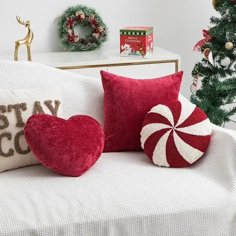 Red velvet heart shaped plush pillow with textured surface from decorbites christmas candy cushions collection