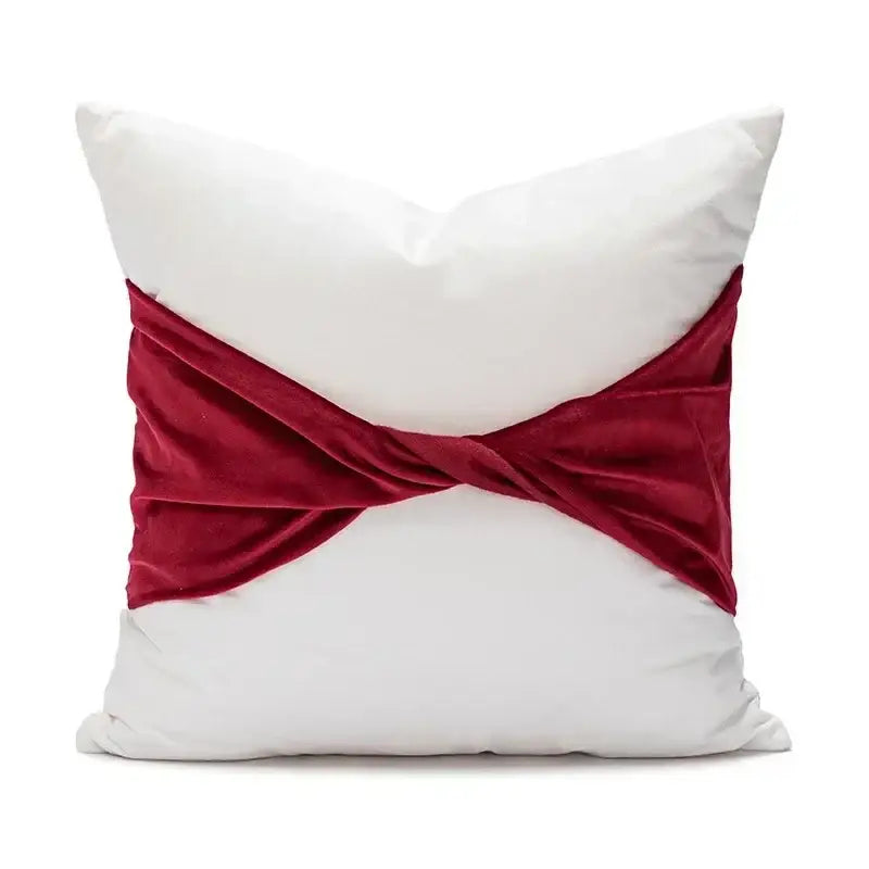 White cushion with burgundy velvet ribbon knot from decorbites christmas candy cushions for festive sofa decor