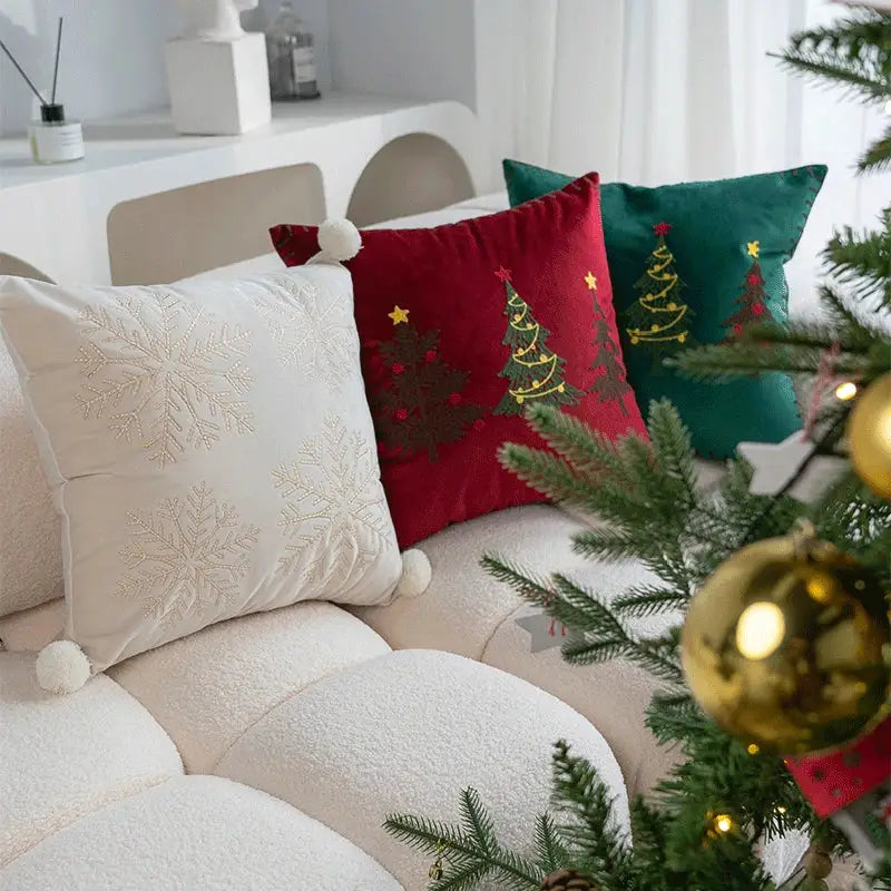 Red velvet pillow cover with embroidered green trees gold stars and white pom-pom from DecorBites Christmas cartoon set