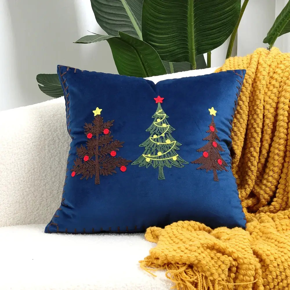 Deep blue velvet pillow cover with decorbites christmas cartoon embroidered trees in red and yellow for festive decor
