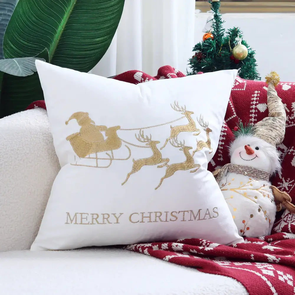 White christmas-themed pillow cover with gold glittery santa sleigh embroidery by decorbites christmas cartoon