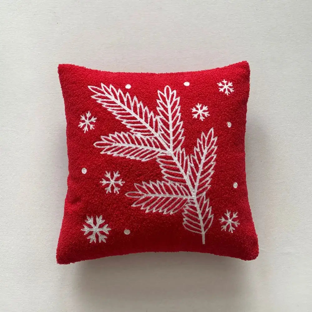 Red plush embroidered pillow with white pine branches and snowflakes from decorbites christmas cartoon embroidered set