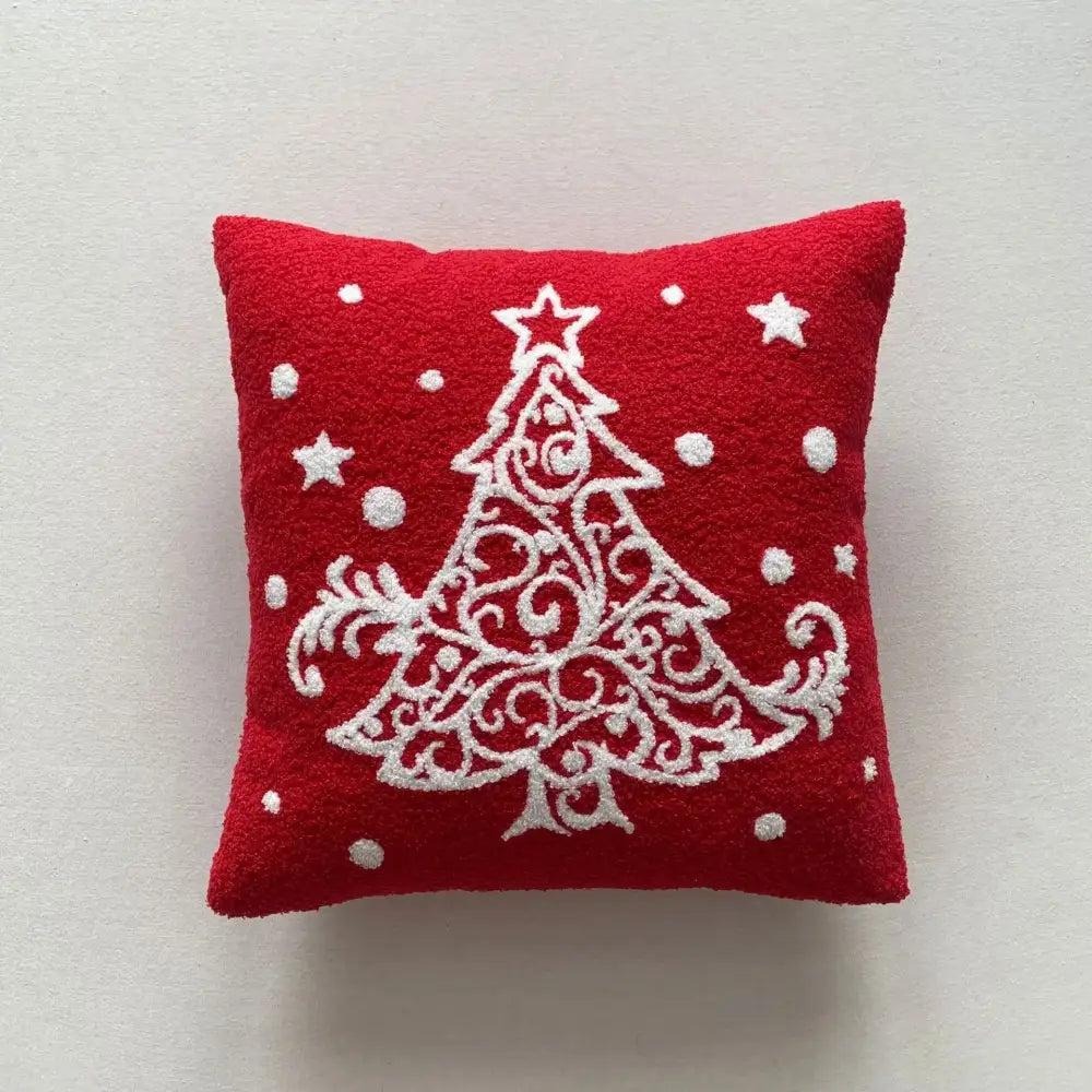 Red felt embroidered pillow featuring a white ornate christmas tree from decorbites christmas cartoon embroidered set