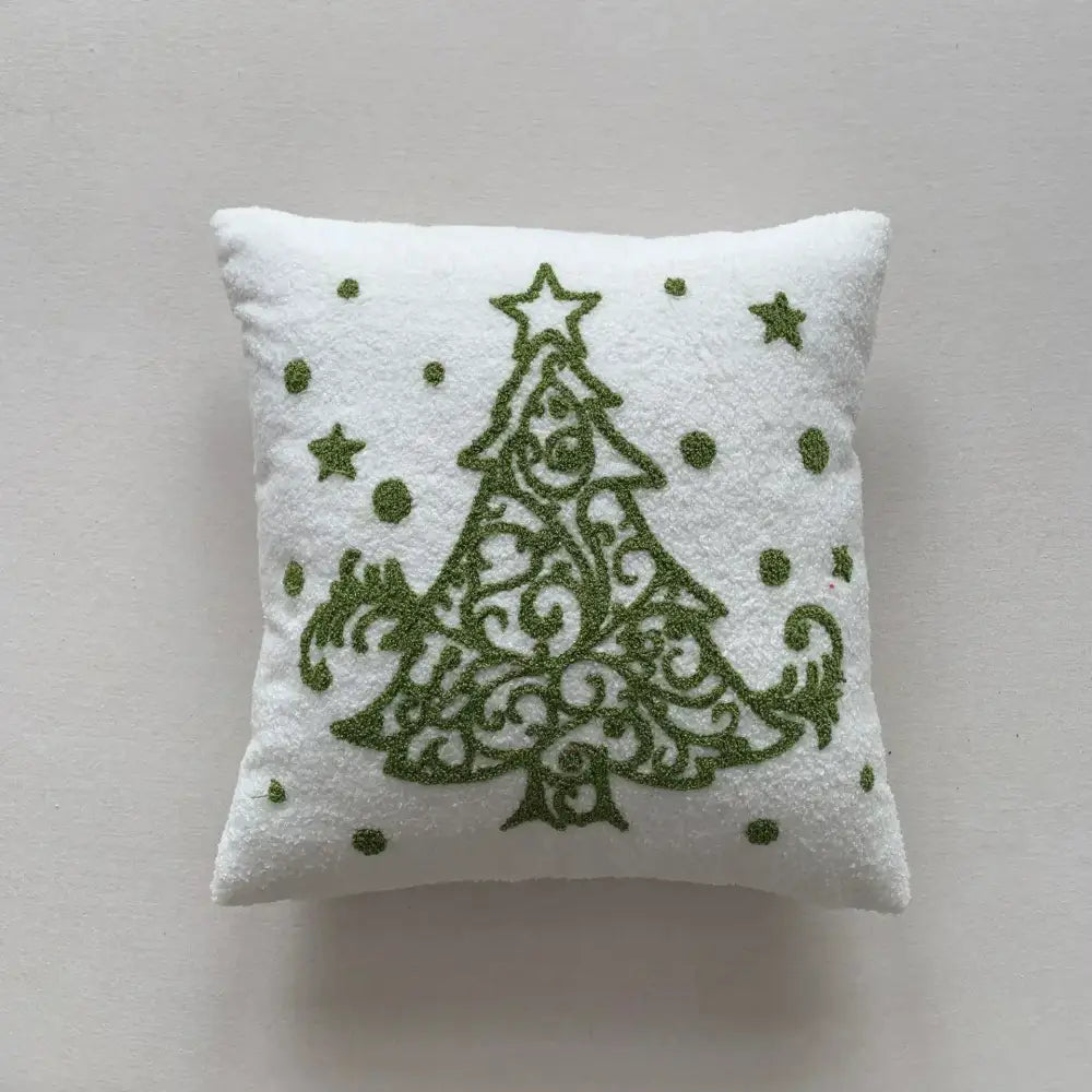 White plush embroidered pillow featuring an ornate olive green christmas cartoon embroidered tree by decorbites christmas cartoon