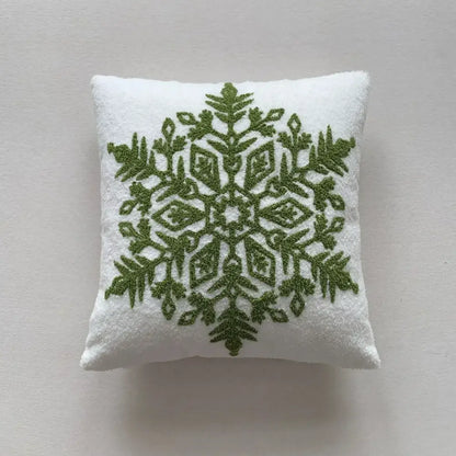White cushion with intricate olive green embroidered snowflake in decorbites christmas cartoon embroidered pillow set