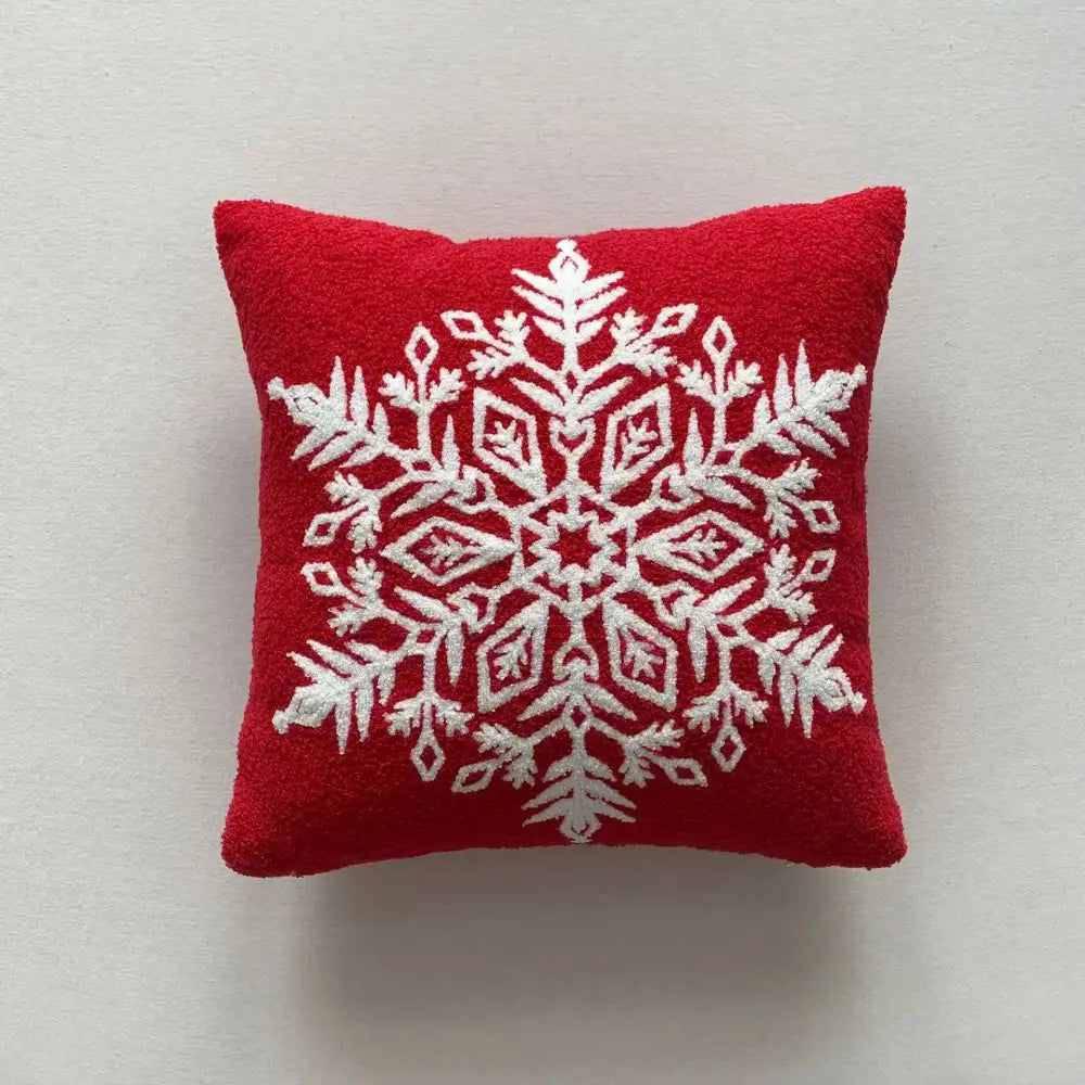 Red cushion pillow cover with white embroidered snowflake design from decorbites christmas cartoon festive collection