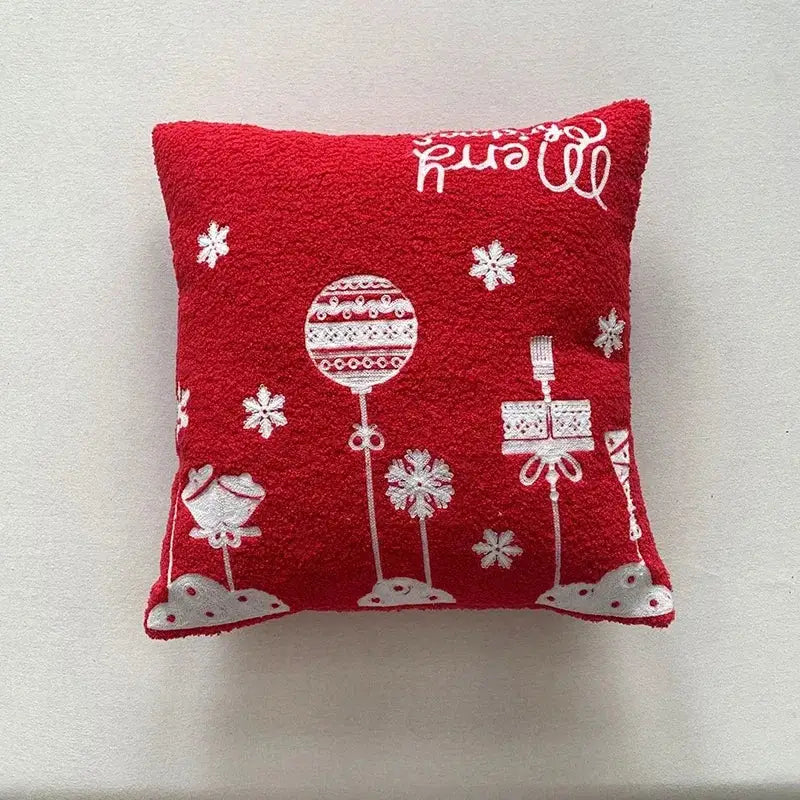 Red textured throw pillow cover with white embroidered christmas ornaments snowflakes and merry script by decorbites christmas cartoon