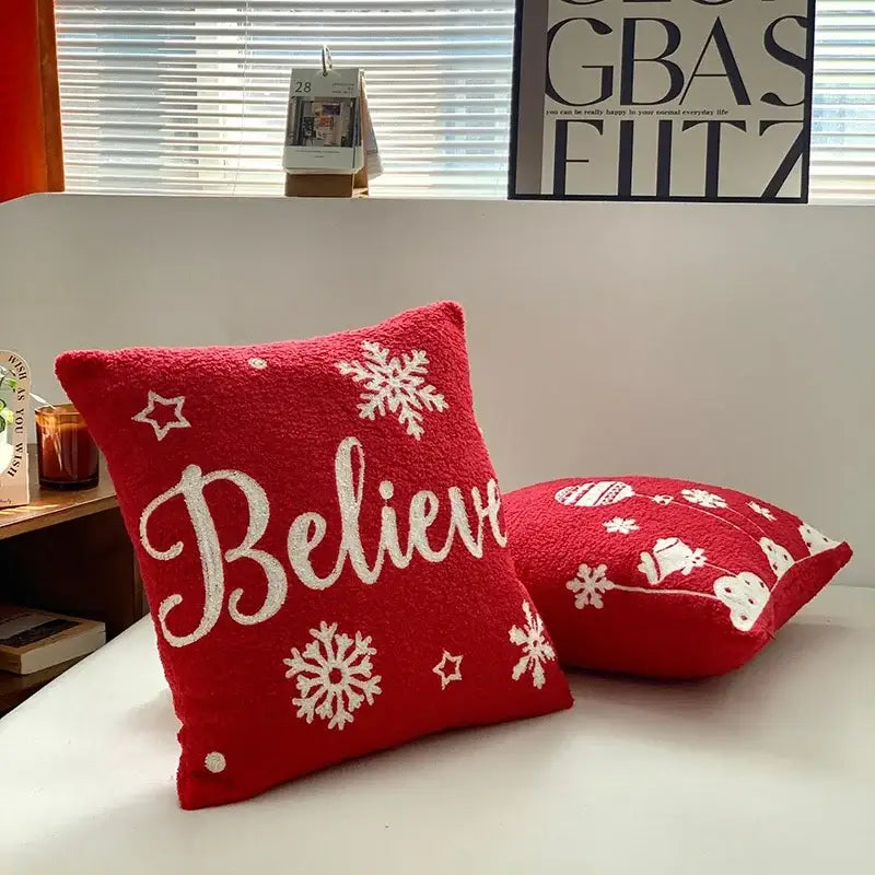 Red plush pillow cover with white embroidered snowflakes stars and believe script for decorbites christmas cartoon festive decor
