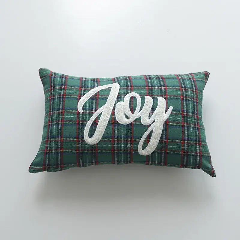 Rectangular green and red plaid pillow cover with joy embroidered in white cursive from decorbites christmas cartoon letter collection