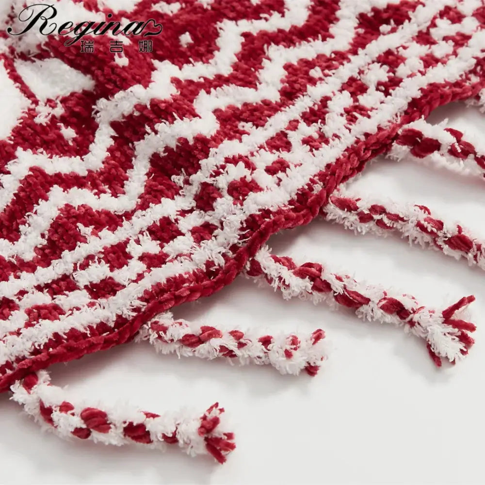 DecorBites christmas chunky knit blanket in red and white microfiber with textured zigzag pattern and fringed ends
