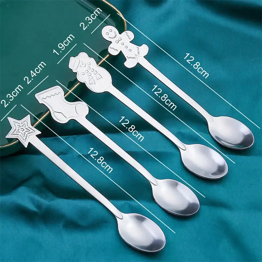 Set of four stainless steel christmas coffee spoons with festive gingerbread man snowman boot and star handles