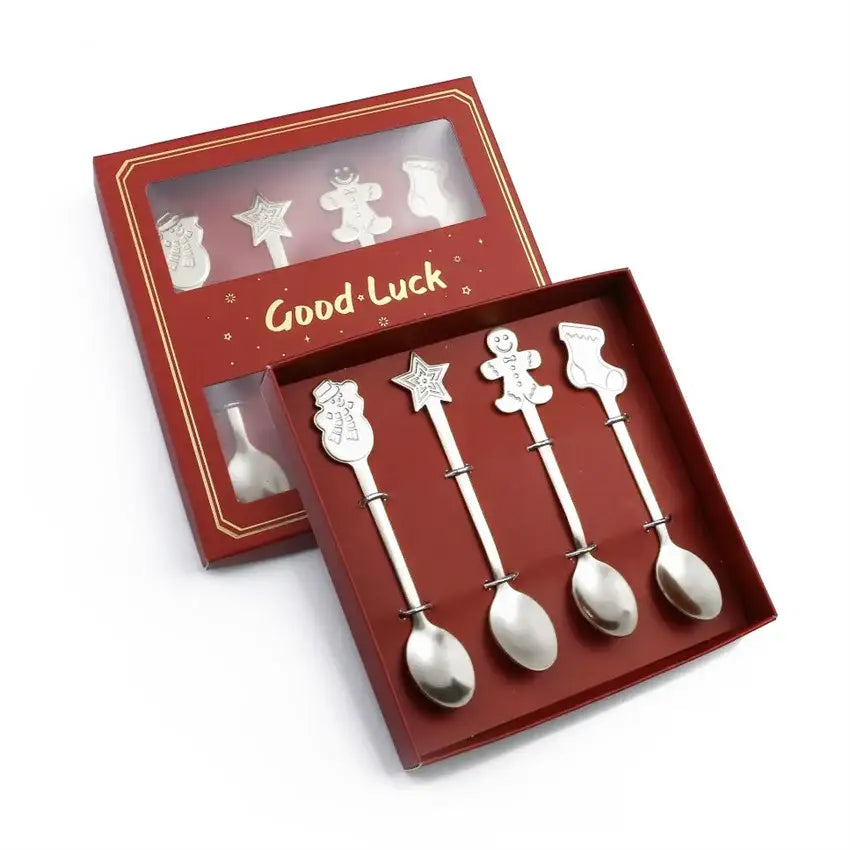 Set of four silver-toned stainless steel christmas coffee spoons with festive designs in a red gift box by DecorBites