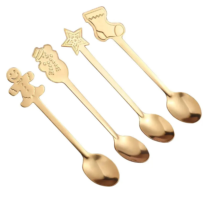 Set of four gold-colored stainless steel christmas coffee spoons with festive gingerbread man, snowman, star, and stocking designs