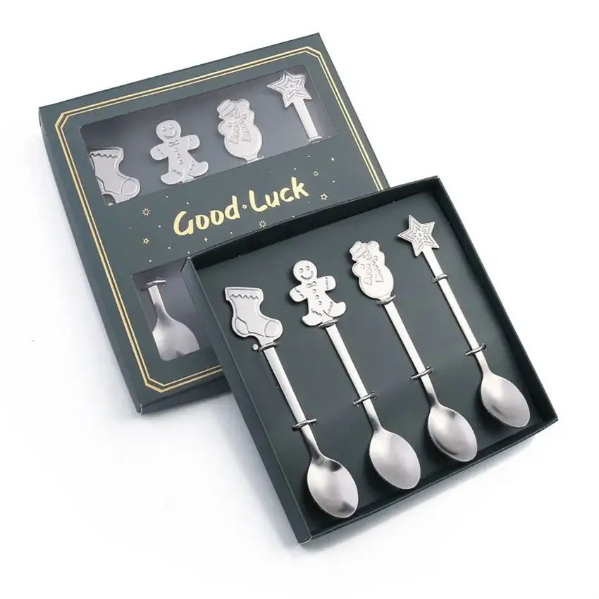Set of five silver-toned stainless steel christmas coffee spoons with festive gingerbread men snowmen and star designs