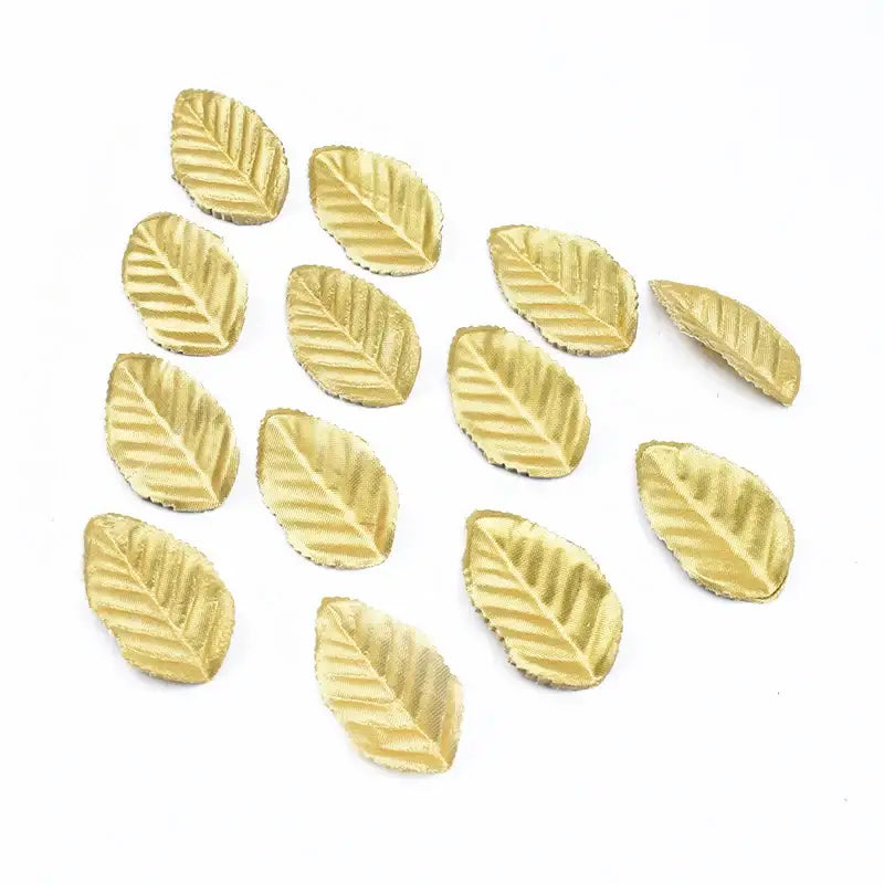 Gold-colored leaf-shaped metal charms with embossed veins for decorbites christmas crafts silk leaf decorations