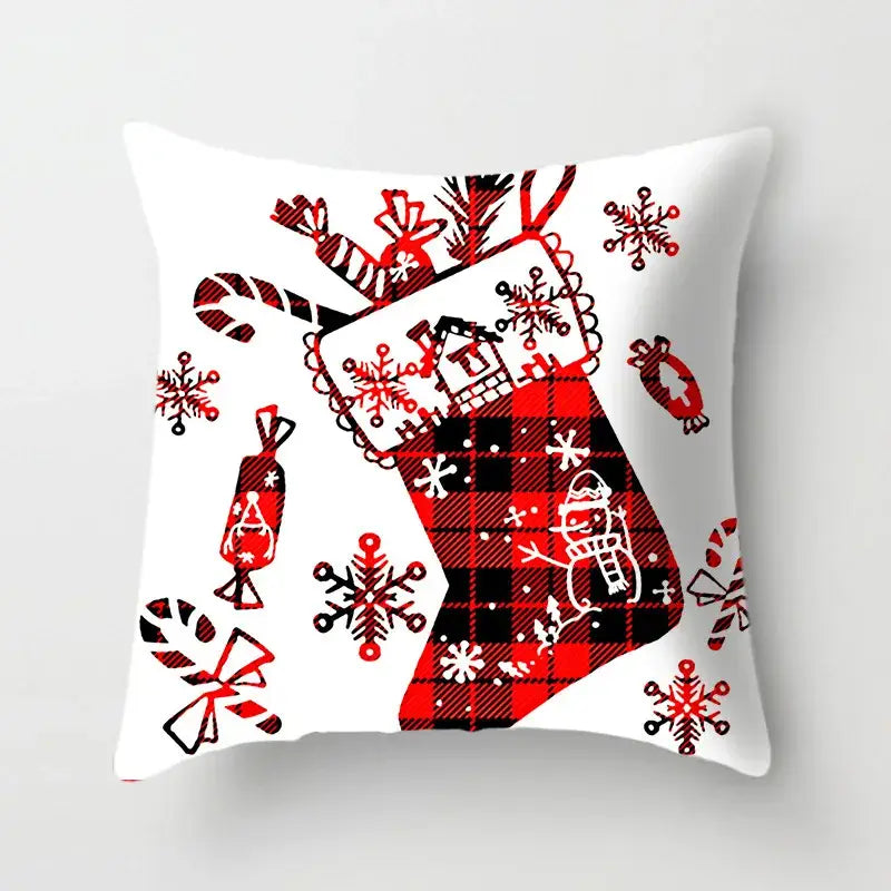 White cushion cover with festive red and black plaid stocking design featuring candy canes snowflakes and gifts decorbites christmas cushion