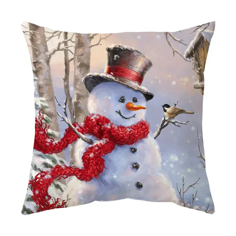 Cozy square decorbites christmas cushion featuring a snowman with a top hat and red scarf in a snowy winter scene