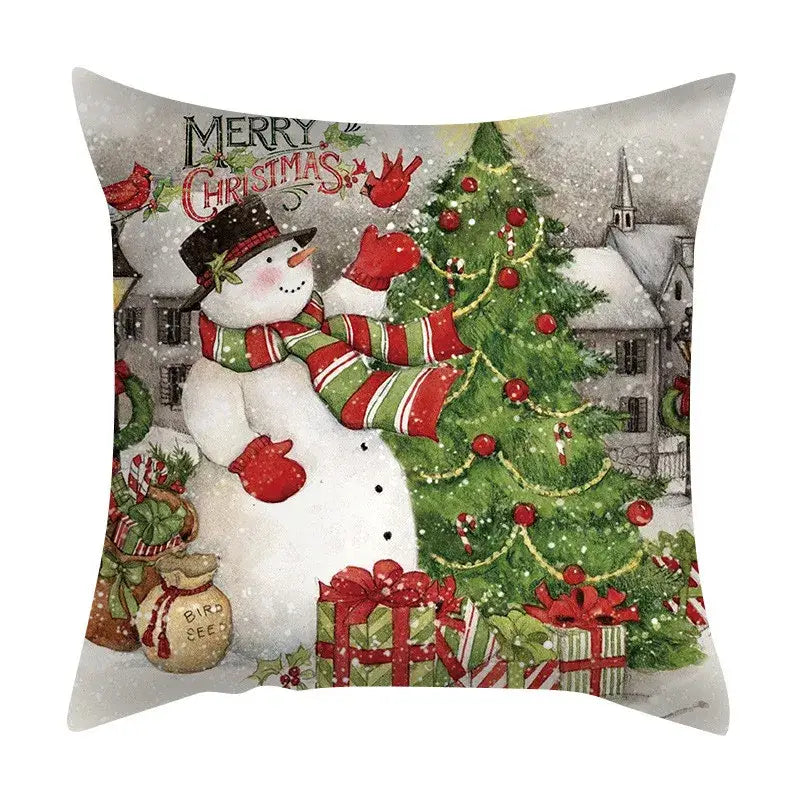 Decorbites christmas cushion cover set featuring a snowman with red and green scarf decorating festive tree with candy canes and birds