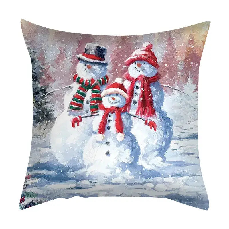 Decorbites christmas cushion cover set featuring a painted scene of three snowmen in festive winter attire on sofa decor