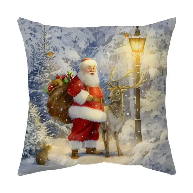 Square decorbites christmas cushion featuring santa claus and reindeer illustration under snowy night sky with streetlamp
