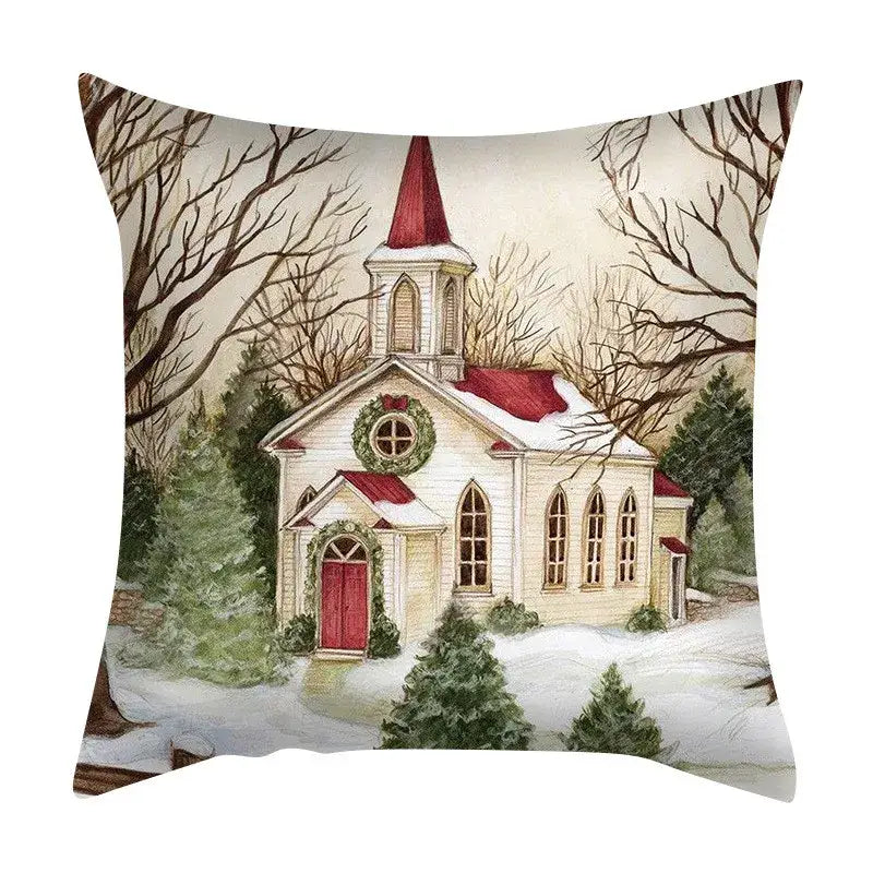 Square decorbites christmas cushion featuring a watercolor snowy church with red roof on a festive cushion cover set