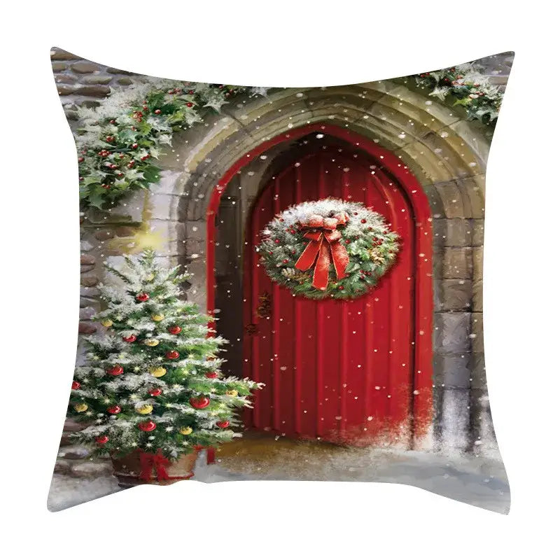 Square decorbites christmas cushion featuring a red door wreath holly garlands and evergreen tree for festive sofa decor