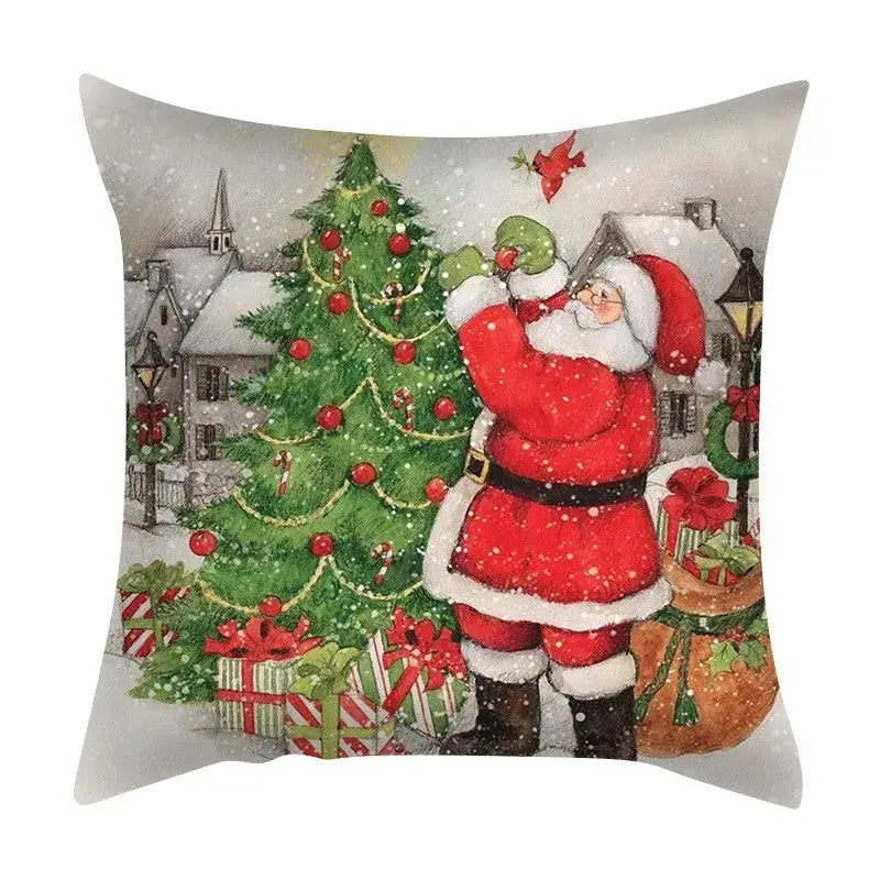 Red and white DecorBites christmas cushion cover featuring a festive tree, gifts, and snowfall for sofa decor