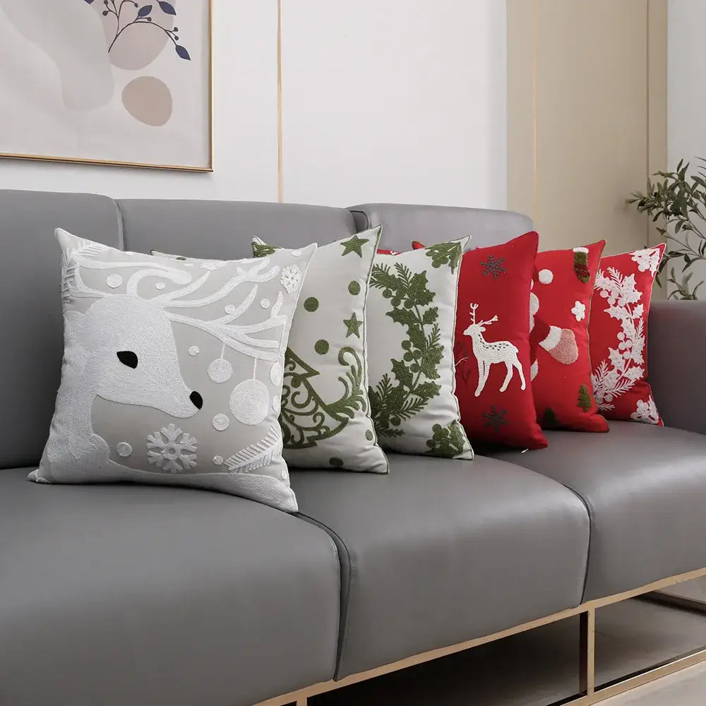 Set of five decorbites christmas décor cushion covers with embroidered reindeer holly snowflakes in gray green and red