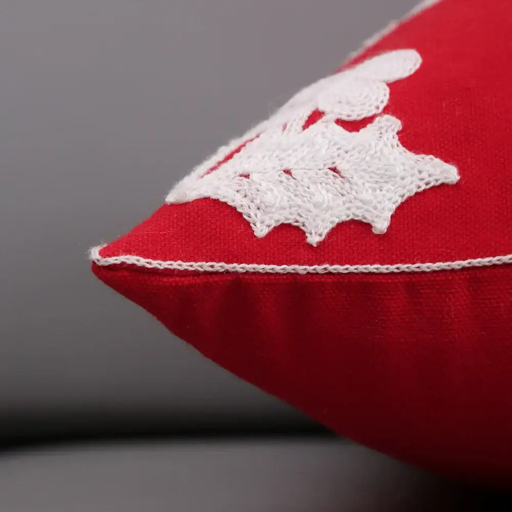Red cushion cover with white lace appliqué and matching stitching from decorbites christmas décor collection