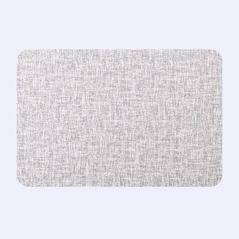 Rectangular gray textured placemat with subtle woven pattern from decorbites christmas decor placemat set