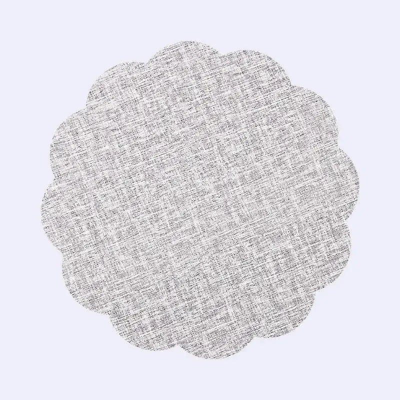 A circular scalloped-edged gray linen placemat with subtle woven texture in decorbites christmas decor placemat set