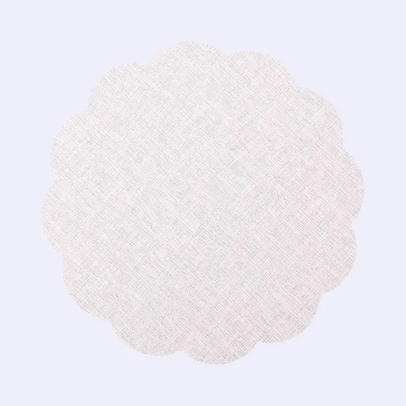 Delicate off-white scalloped fabric doily with subtle woven texture in DecorBites Christmas decor placemat set