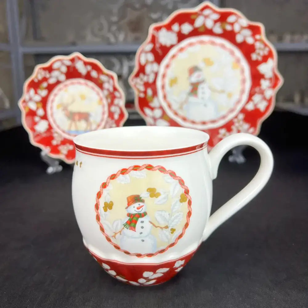 White ceramic mug with red trim and snowman design from decorbites christmas dinnerware set for festive use
