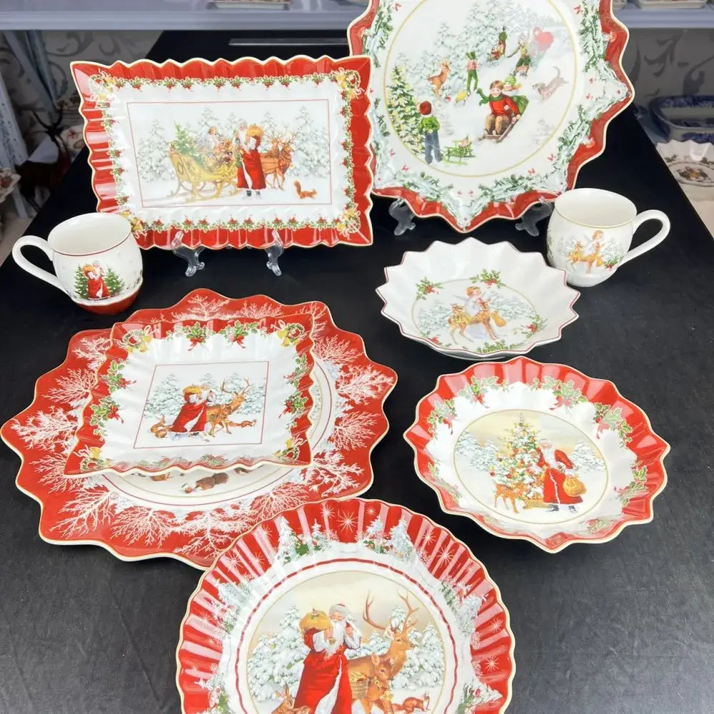 Red and white ceramic decorbites christmas dinnerware set with festive holiday illustrations including plates mugs and bowls