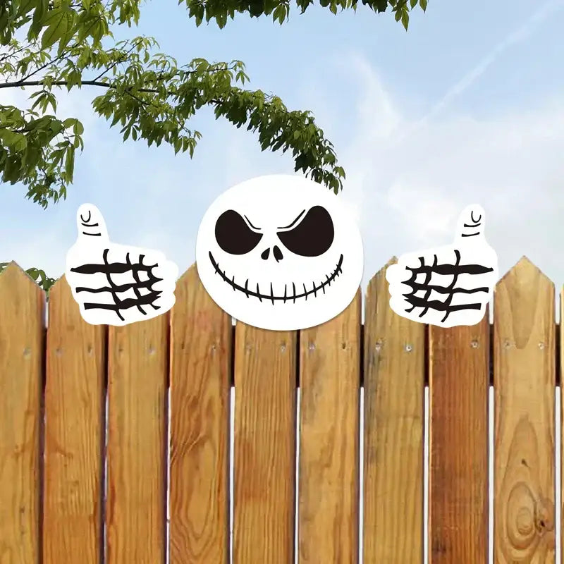 White jack skellington face sticker with black eyes and stitched smile flanked by thumbs-up hands in decorbites christmas door frame set