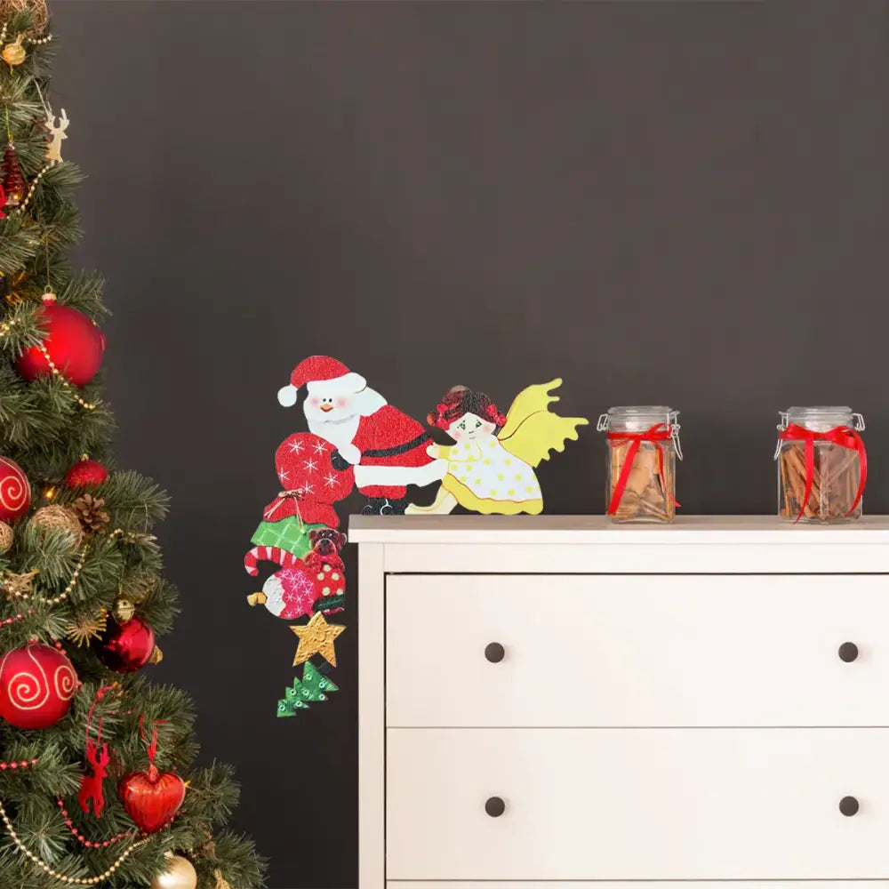 Red and white glittery santa claus wall decal with yellow-winged angel in decorbites christmas door frame set