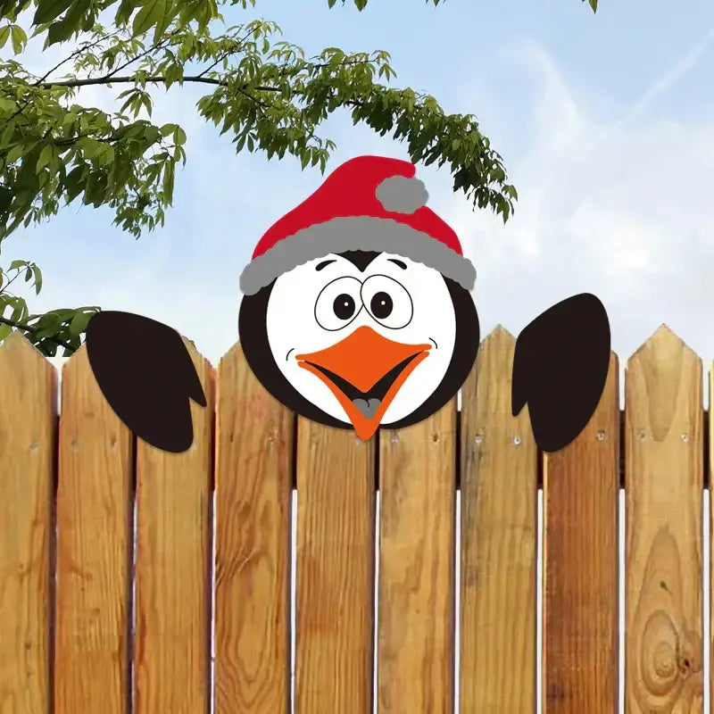 A cheerful cartoon penguin wearing a red santa hat included in decorbites christmas door frame wood pendants and stickers set