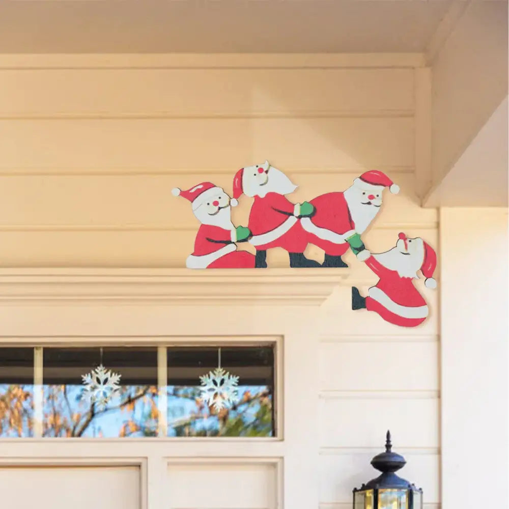 Red and white wooden santa claus cutout with green gloves in decorbites christmas door frame decor set for festive use