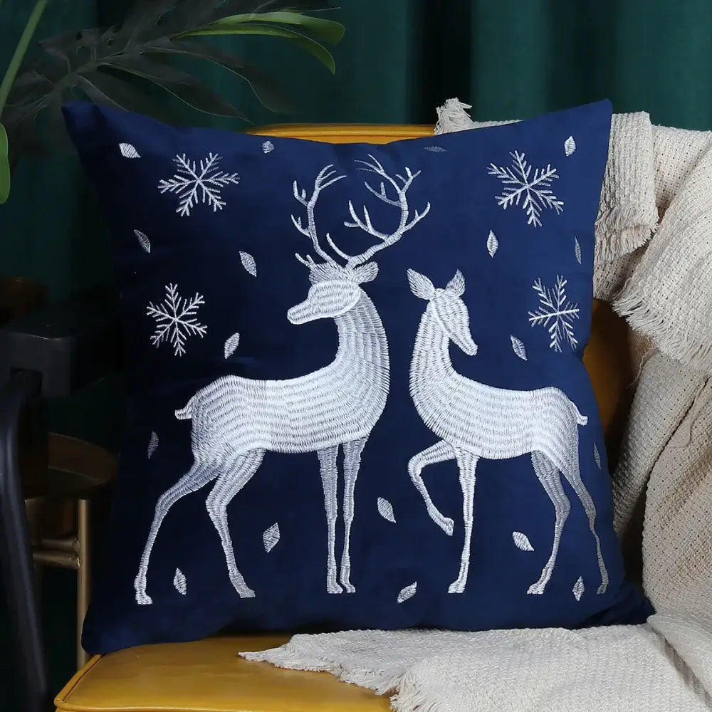 Navy blue cushion cover featuring christmas elk embroidered white deer and snowflakes by DecorBites Christmas Elk