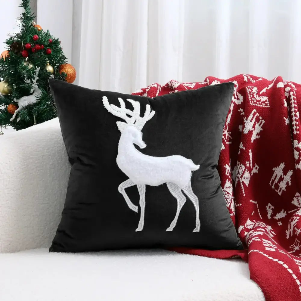 Black velvet pillow cover with white embroidered christmas elk design by decorbites for festive decoration