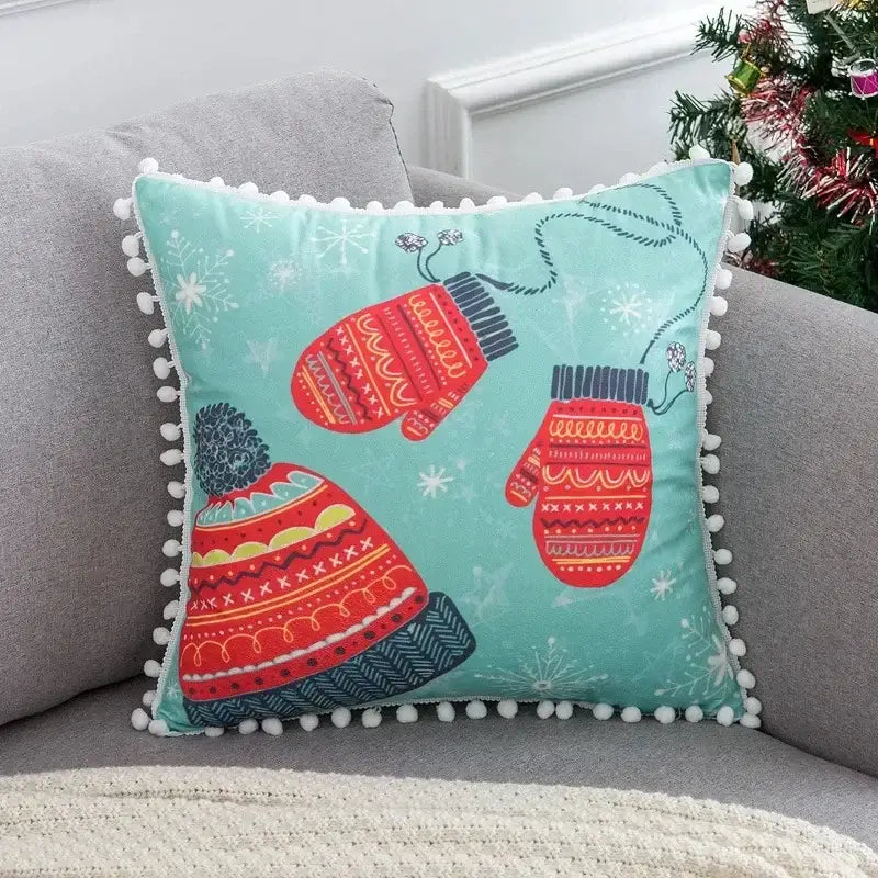 A festive teal decorbites christmas elk pillowcase 45x45cm with embroidered red and navy mittens and red letter design