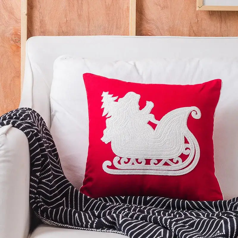 Red square decorbites christmas embroidered pillow cover with white sleigh design made of cotton canvas for holiday decor