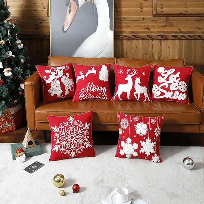 Red christmas embroidered cotton pillow covers by decorbites featuring white reindeer snowflakes and holiday designs