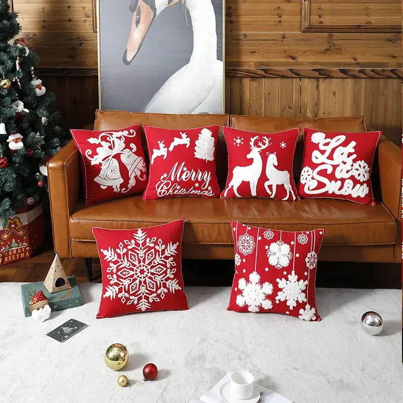 Red christmas embroidered cotton pillow covers by decorbites featuring white reindeer snowflakes and holiday designs