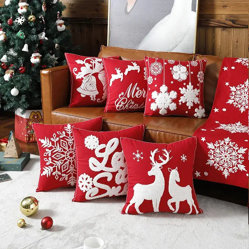 Red decorbites christmas embroidered cotton pillow covers with festive white reindeer, snowflake, and bell designs