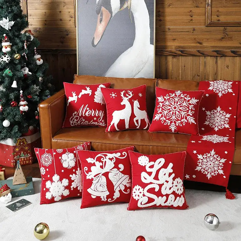 Red christmas embroidered cotton pillow covers by decorbites featuring snowflakes elk bells and holiday greetings
