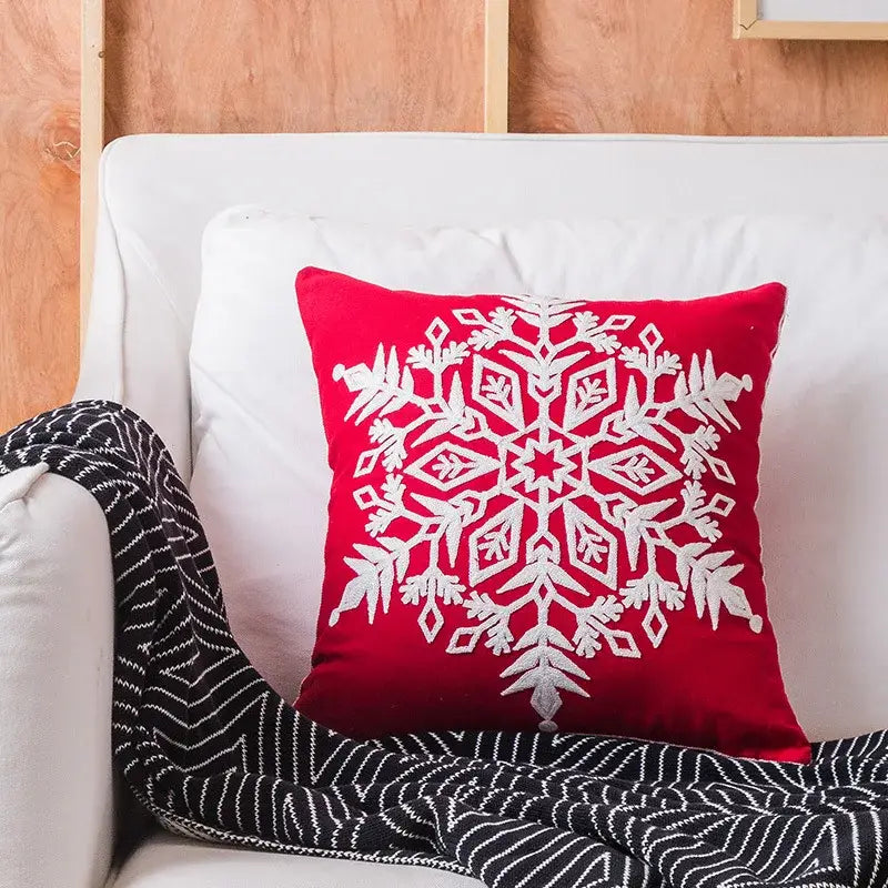 Red velvet decorbites christmas embroidered pillow cover with intricate white snowflake design in cotton canvas