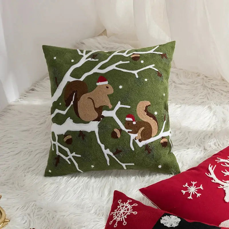 Olive green decorbites christmas embroidered cushion cover 45x45cm featuring squirrels with red santa hats on snow branches